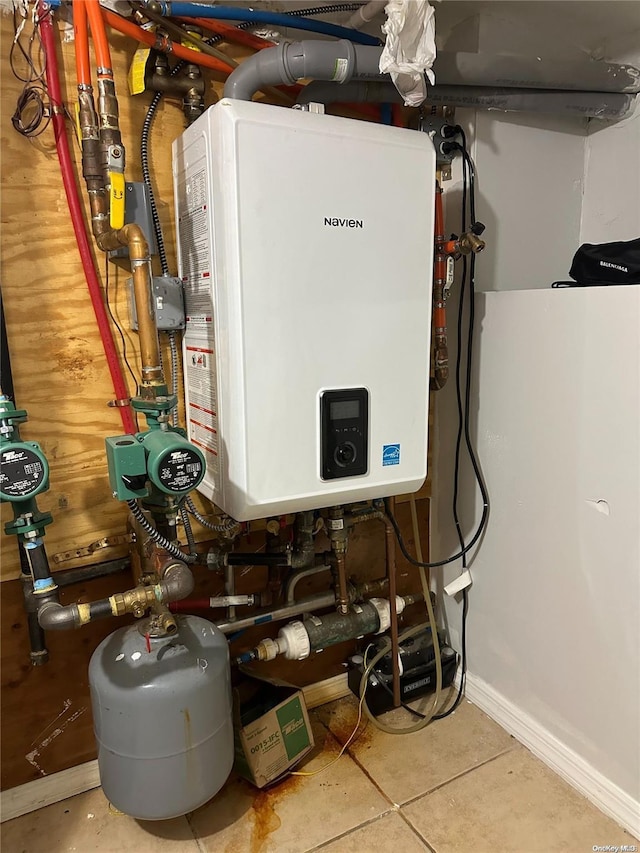 utility room featuring tankless water heater