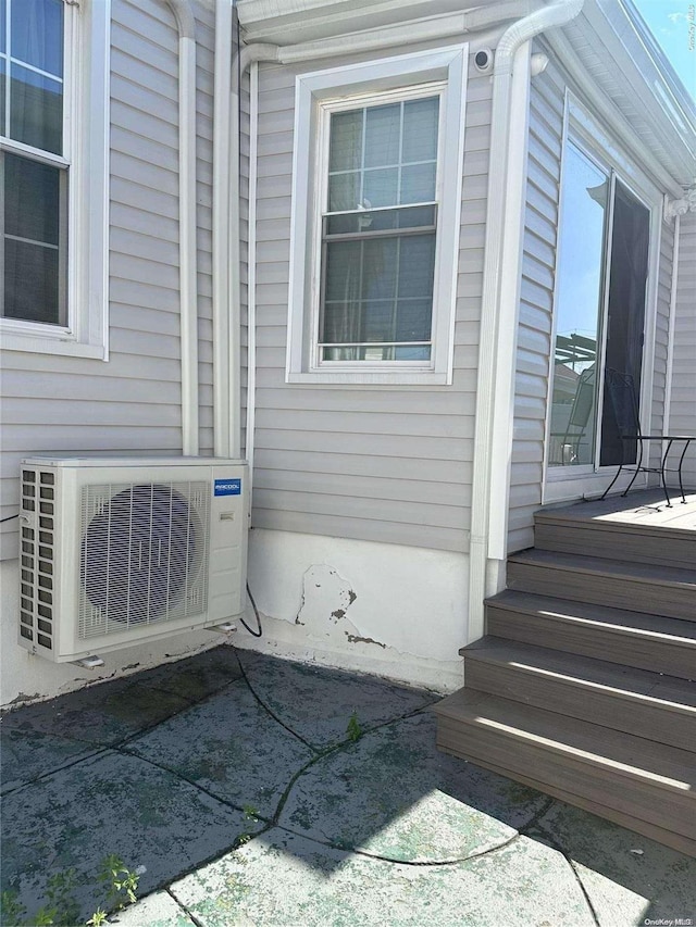 exterior space featuring ac unit