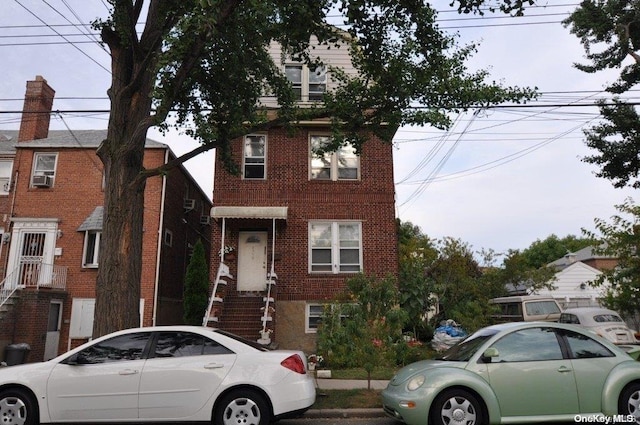 view of front of home with cooling unit