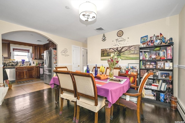 dining space with light hardwood / wood-style floors