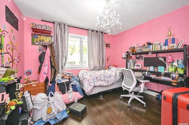 bedroom featuring hardwood / wood-style flooring and an inviting chandelier