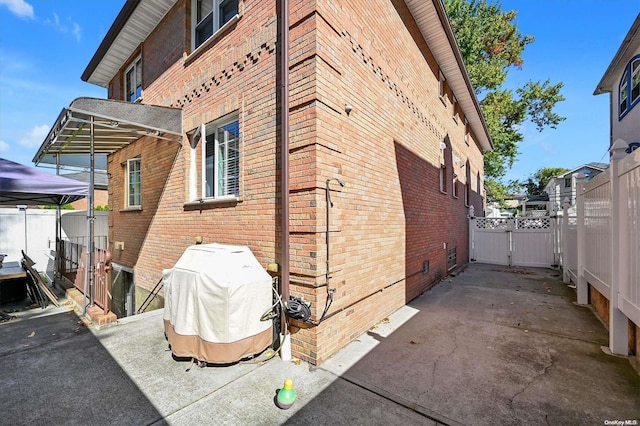 view of side of home featuring a patio