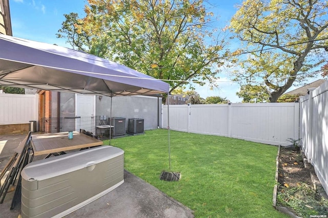 view of yard with a gazebo and central AC