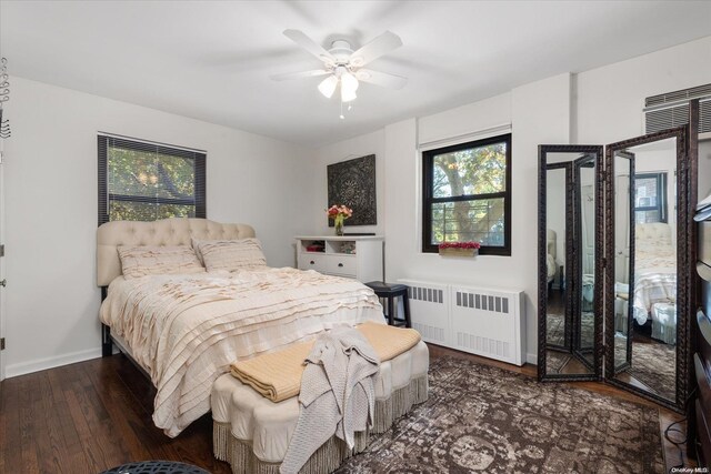 bedroom featuring radiator, ceiling fan, and dark hardwood / wood-style flooring