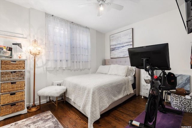 bedroom featuring dark hardwood / wood-style flooring and ceiling fan