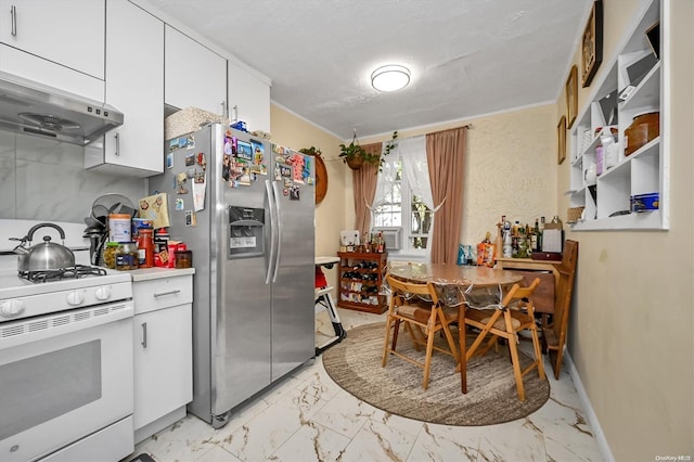 kitchen with stainless steel fridge, gas range gas stove, white cabinets, and a textured ceiling