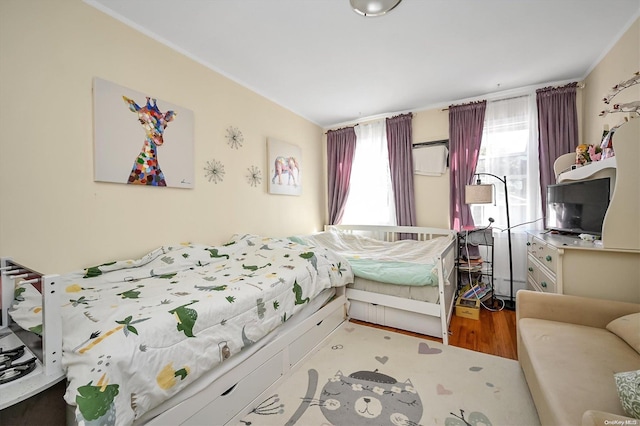 bedroom featuring hardwood / wood-style flooring