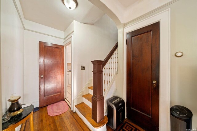 193-32 Foothill Ave, Holliswood, NY 11423 - entryway with arched walkways, wood finished floors, and stairway
