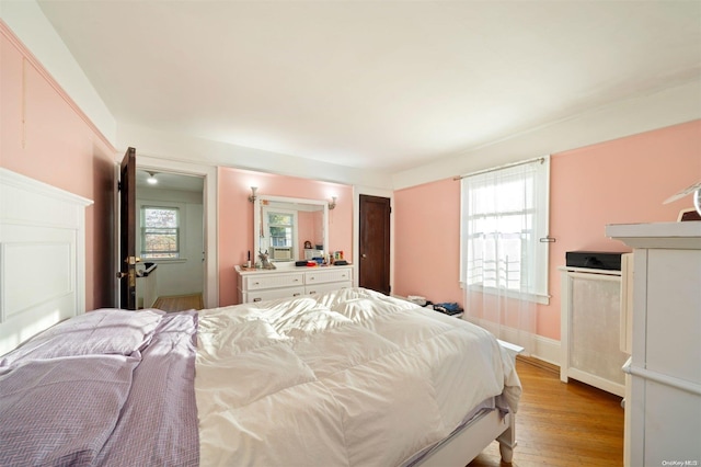 bedroom with light wood-type flooring