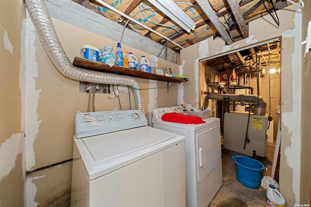 clothes washing area with washing machine and clothes dryer