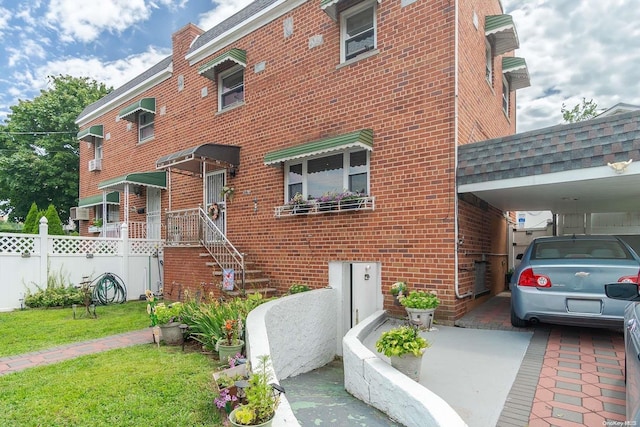 view of front of property with a carport