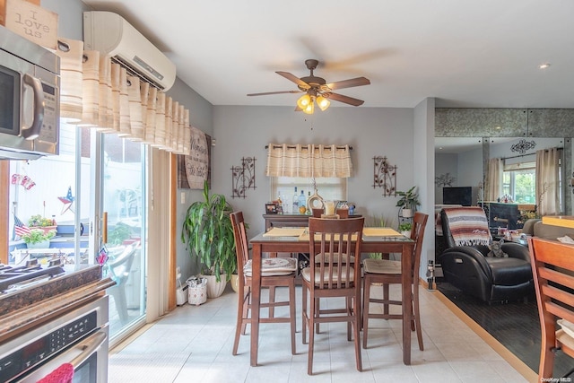 tiled dining area with a wall mounted AC and ceiling fan