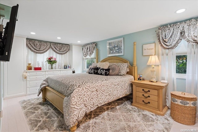 bedroom with light wood-type flooring