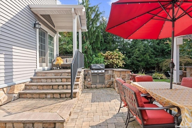 view of patio / terrace with area for grilling and exterior kitchen