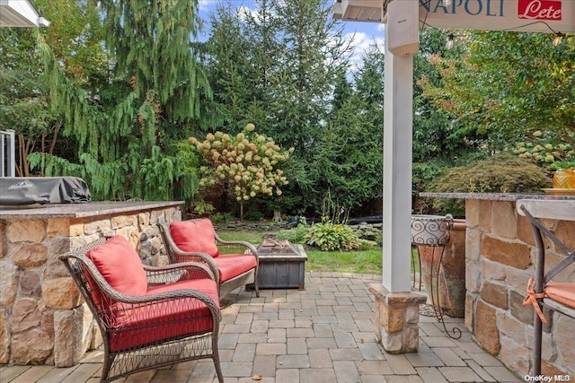 view of patio featuring a fire pit and area for grilling