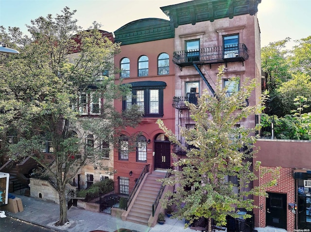 view of front of property with a balcony