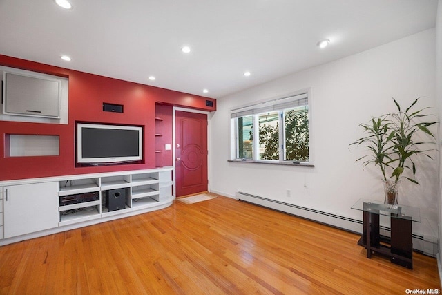 unfurnished living room with wood-type flooring