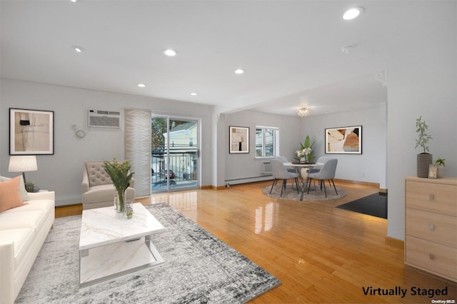 living room featuring a wall mounted air conditioner, light wood-type flooring, and a baseboard radiator