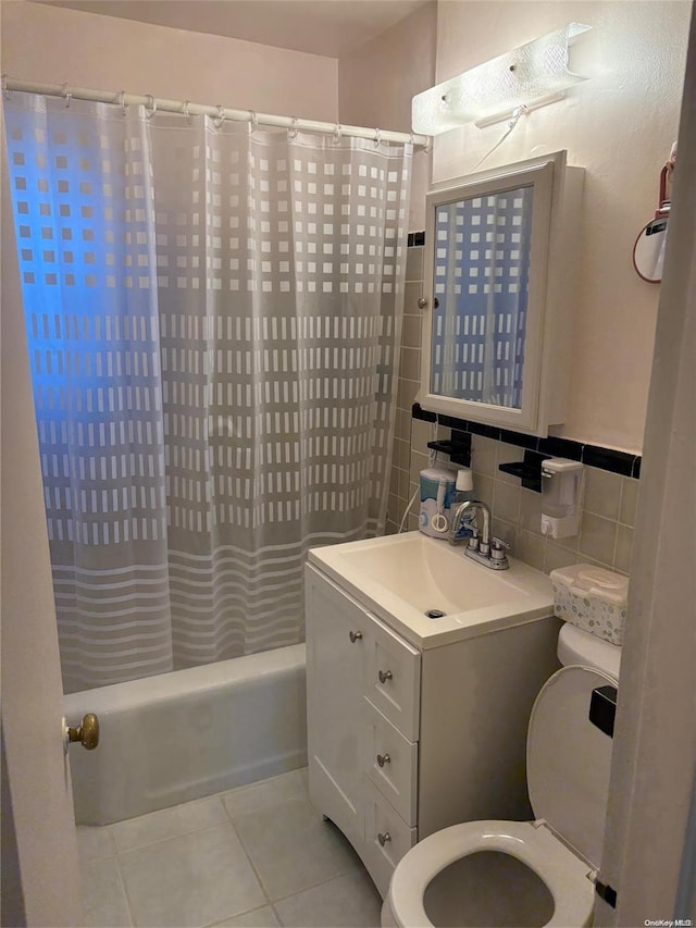 full bathroom featuring tile patterned flooring, backsplash, toilet, shower / tub combo with curtain, and vanity