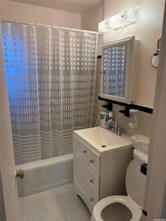 76-04 Springfield Blvd Unit 1, Bayside, NY 11364 - full bath with toilet, tile patterned flooring, shower / bath combination with curtain, and vanity