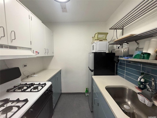 kitchen with backsplash, white cabinetry, sink, and white appliances