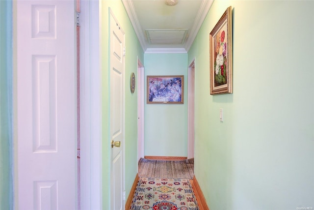 hall with hardwood / wood-style flooring and crown molding