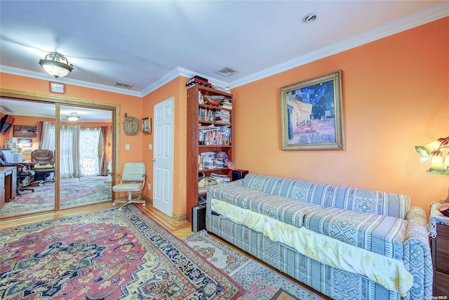 living room featuring crown molding and hardwood / wood-style floors