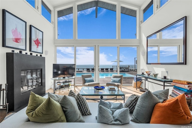 living room with high vaulted ceiling