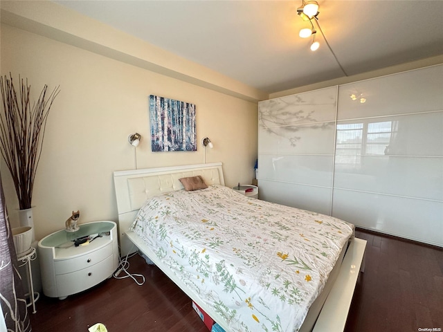 bedroom featuring dark hardwood / wood-style floors