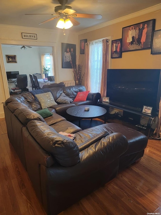 living room with hardwood / wood-style floors, ceiling fan, crown molding, and a wealth of natural light