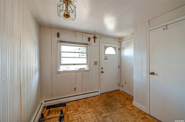 foyer featuring light parquet floors and a baseboard heating unit