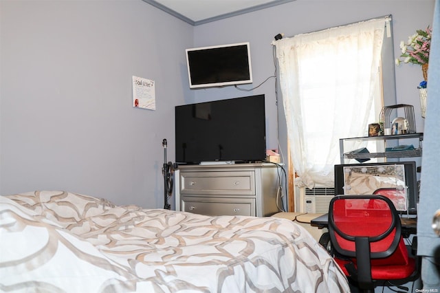 bedroom with crown molding