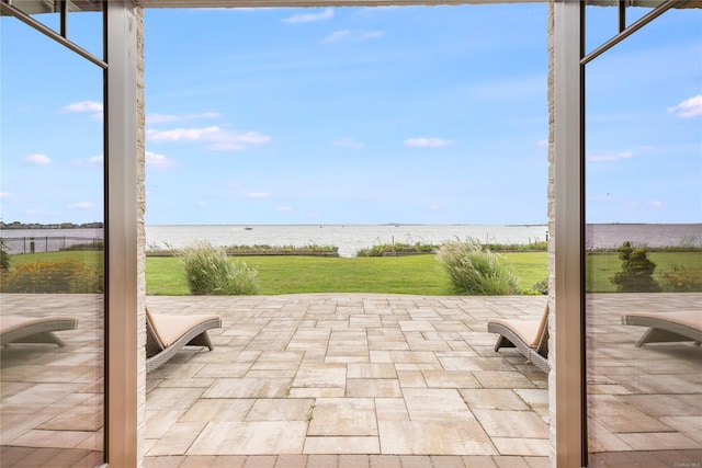 view of patio / terrace with a water view