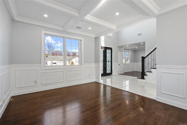 entrance foyer featuring beamed ceiling, hardwood / wood-style flooring, and crown molding