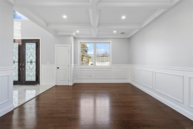 entrance foyer with coffered ceiling, french doors, ornamental molding, beam ceiling, and dark hardwood / wood-style flooring