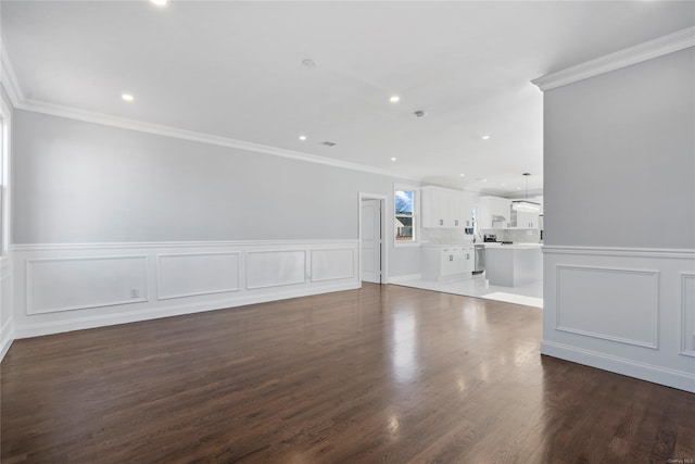 unfurnished room featuring dark hardwood / wood-style floors and crown molding