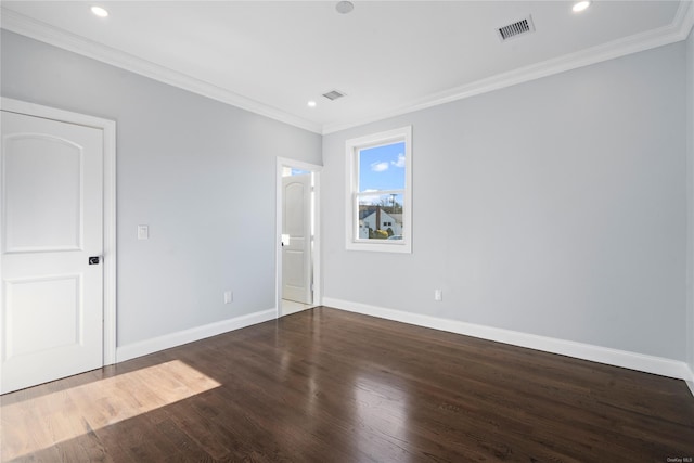 unfurnished room featuring dark hardwood / wood-style flooring and ornamental molding