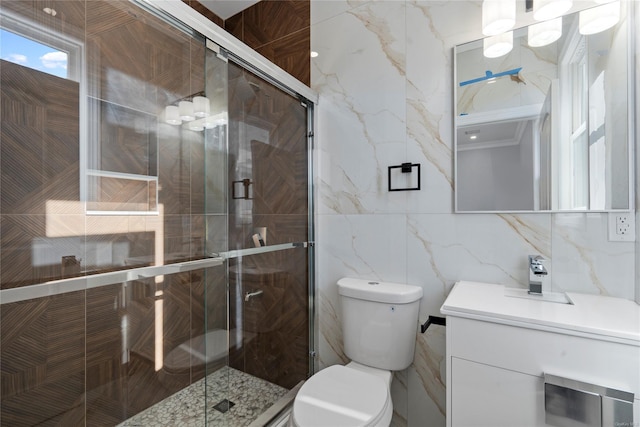 bathroom featuring sink, toilet, a shower with door, and tile walls