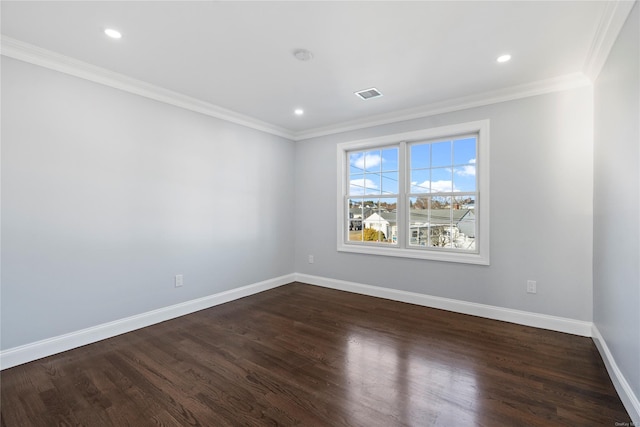 spare room with dark hardwood / wood-style floors and crown molding