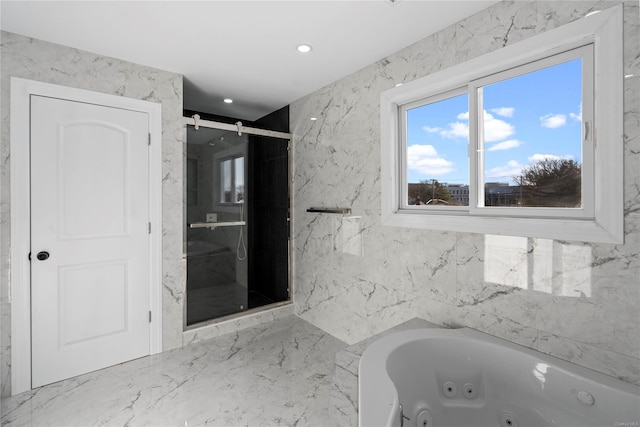 bathroom featuring independent shower and bath and tile walls