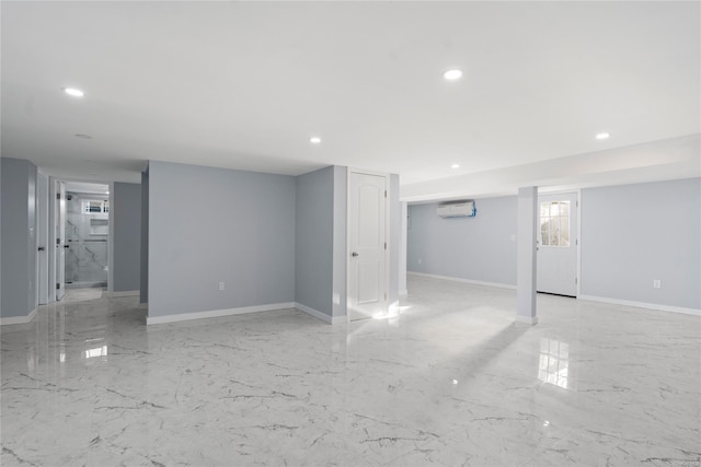 basement with a wall mounted air conditioner