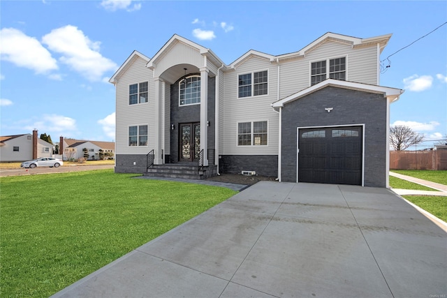 view of front of property with a front yard and a garage