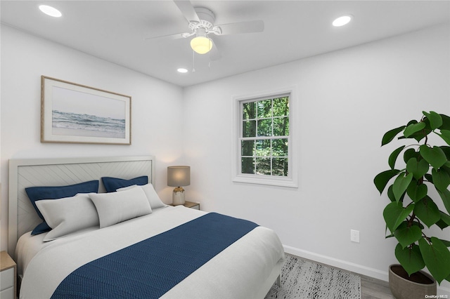 bedroom featuring light hardwood / wood-style floors and ceiling fan