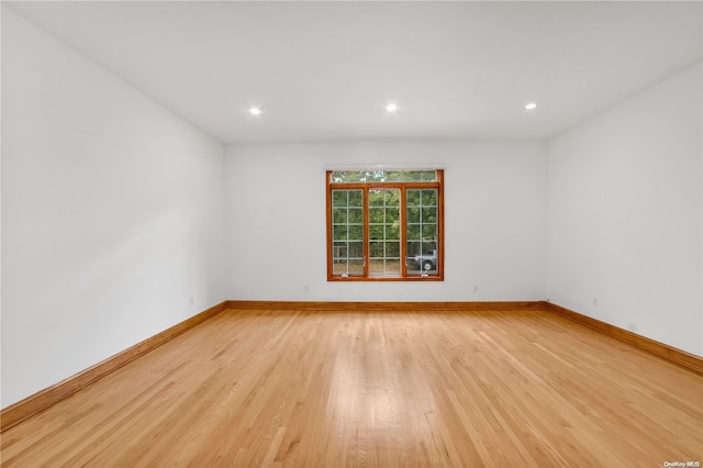 empty room with light hardwood / wood-style floors