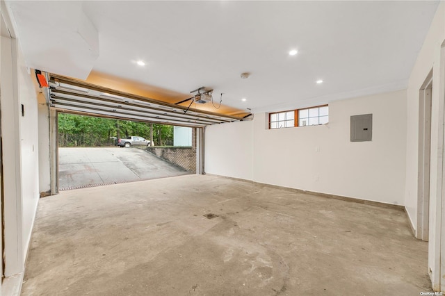 garage featuring electric panel and a garage door opener