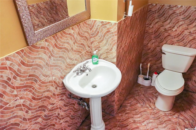 bathroom featuring tile patterned flooring and toilet