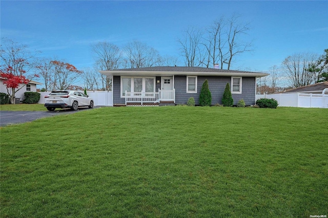 ranch-style house with a front lawn and a porch