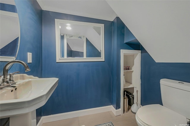 bathroom with tile patterned floors, sink, and toilet