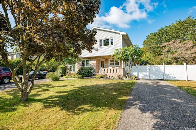 view of front of home with a front lawn