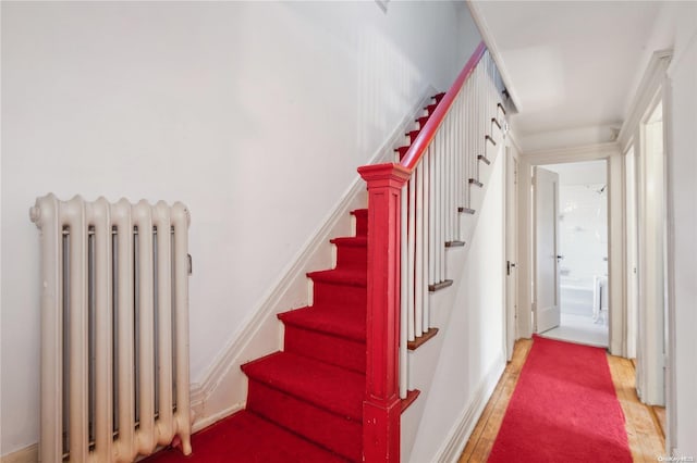 staircase featuring radiator heating unit